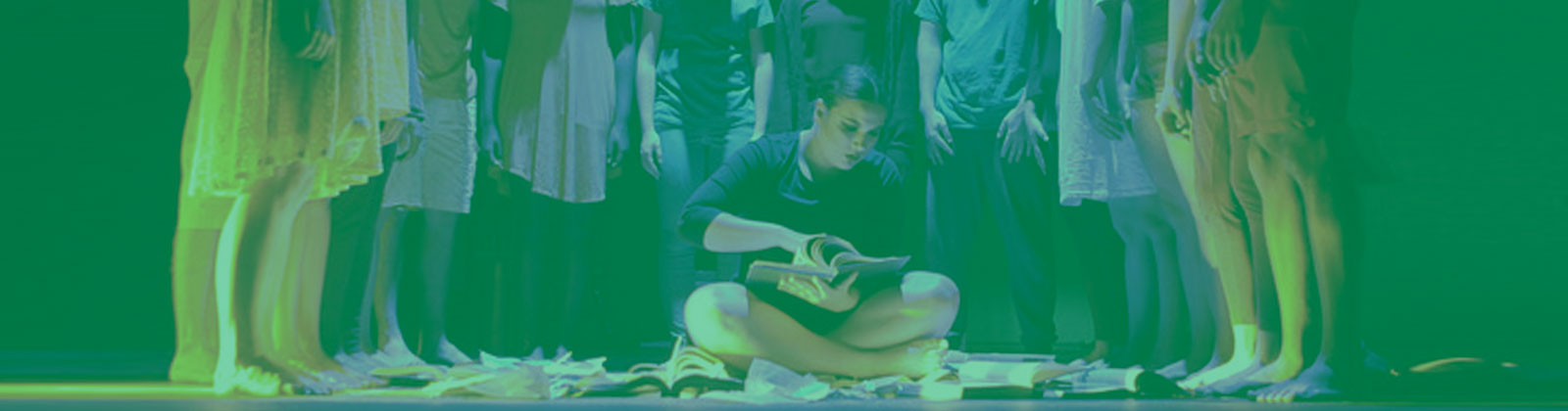 Dance Performance Girl sitting with book with group surrounding her