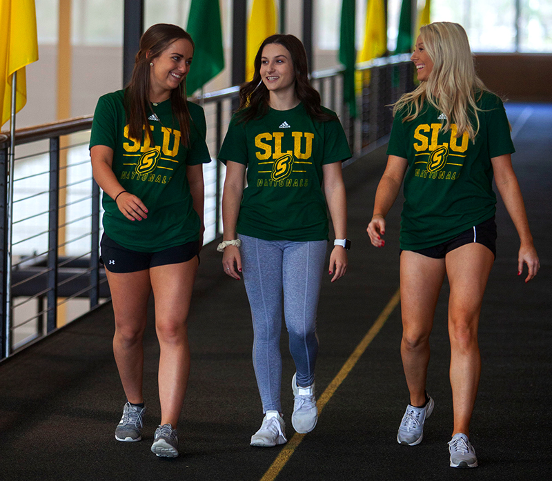 Students walking on the raised track in the Rec Center