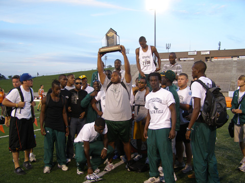 Men's track and field athletes display their SEC trophy