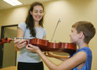 CMS violin instructor Felicia Besan and young student at Livingston Center