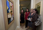 Guests Barbara Smith, Sharon Sledge, Pat Macaluso, and Elizabeth Smith admire artwork at Southeastern's Fine Arts Showcase.