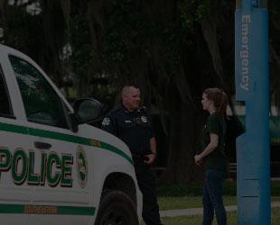 Police Officer Talking with Student