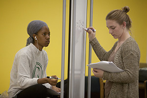 Students studying together on second floor of the Library