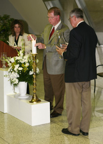 President Moffett and Vice President Miller light memorial candle
