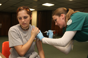 Jeanne Callahan of Denham Springs receives an H1N1 vaccine from Southeastern nursing student Ashley Ward of Baton Rouge.