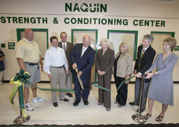 Hammond businessman Ray Naquin cuts the ribbon officially dedicating the Naquin Strength and Conditioning Center at Southeastern Louisiana University. Participating in the event are, from left, strength and conditioning coach Scott Reeves, Marcus Naquin, Interim Athletic Director Tim Baldwin, Naquin and his wife Ruth, Michelle Naquin Cartier, Southeastern President John L. Crain, and Anna Woodall, assistant to the athletic director.