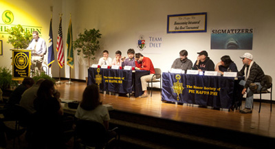 Faculty and student teams compete in the Quiz Bowl.