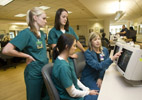 North Oaks Health System staff nurse Anna Price explains the ICU monitoring system to Southeastern Louisiana University nursing students. From left, standing are senior Sarah Bates of Denham Springs, senior Sarah Rich of Tickfaw and, seated, junior Brittany Horning of Franklinton.