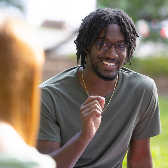 Students talking to each other.outside.
