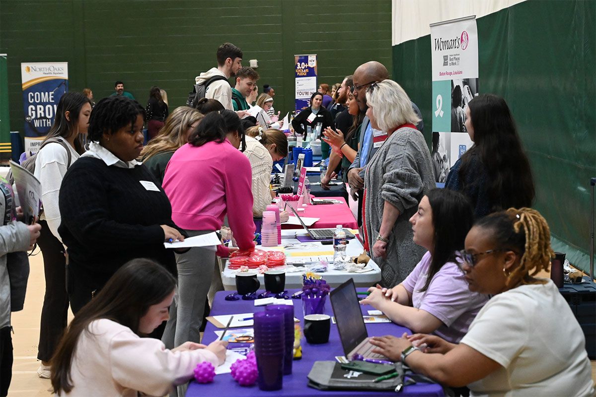 Students speaking with health professionals at Southeastern.