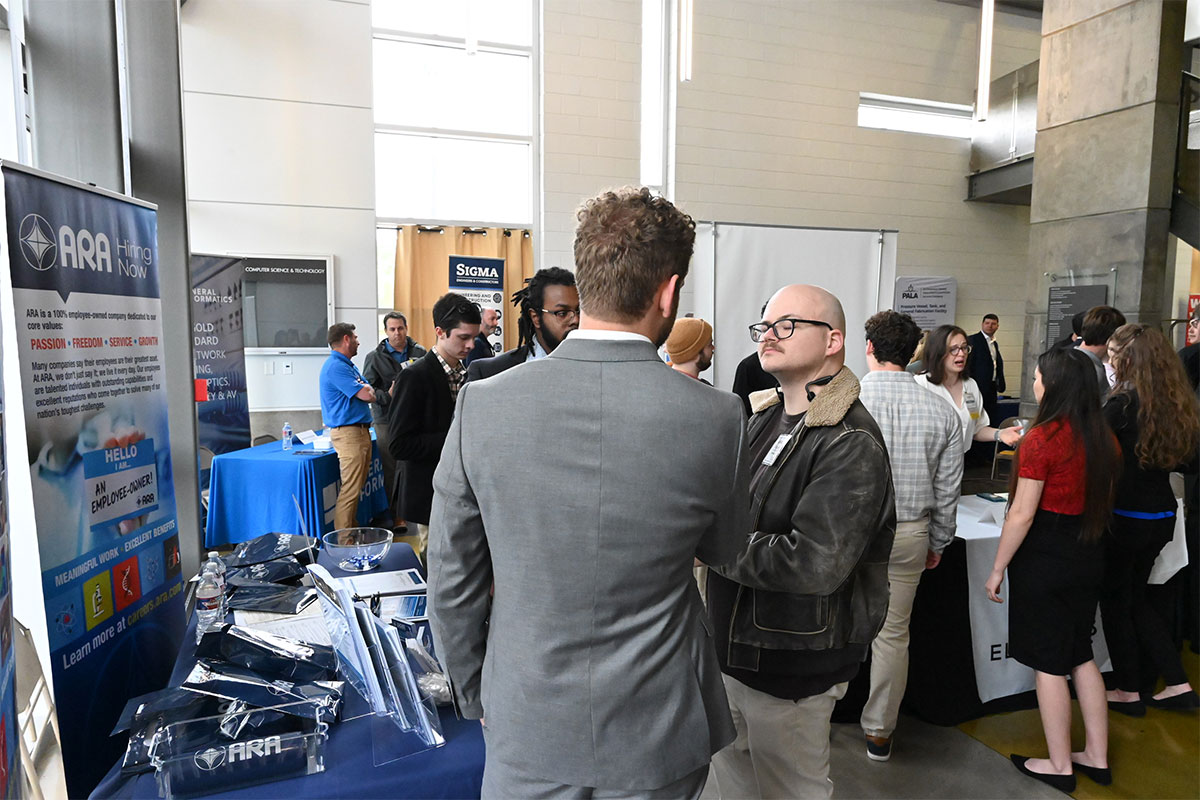 Student speaking with a professional in the field at Southeastern.