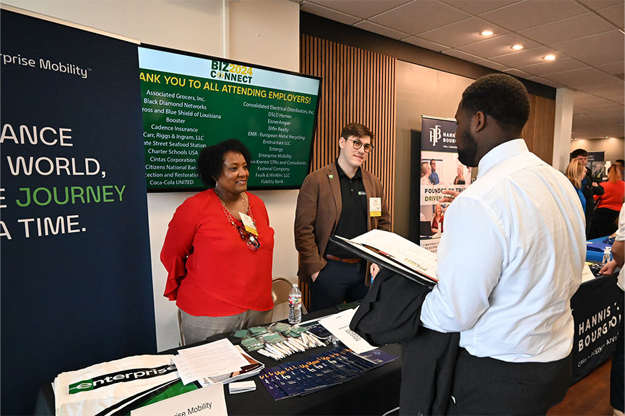 Student talking to professionals at Biz-Connect event at Southeastern