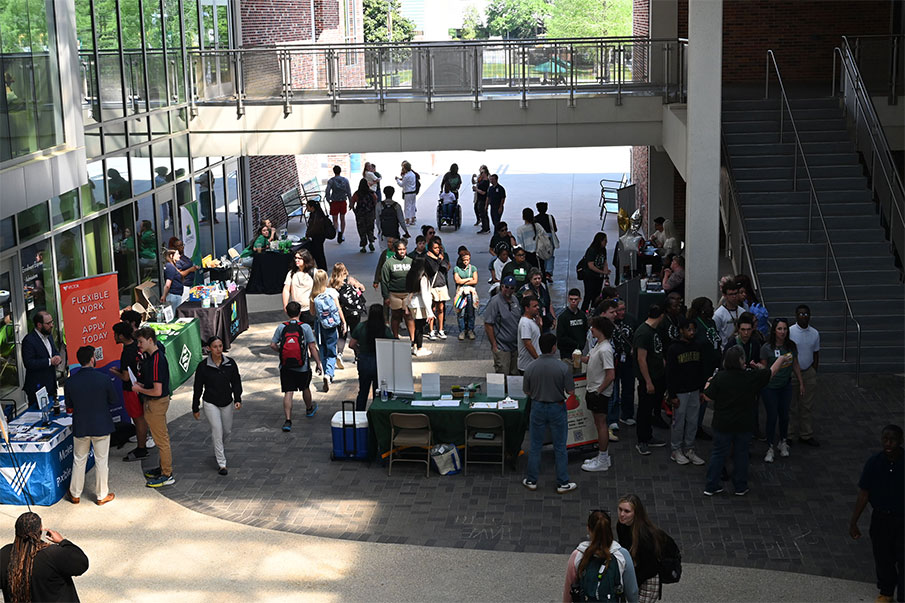 Students walking around at Part-Time Job Fair held in the student union breezeway