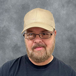 Headshot of Christopher Genre