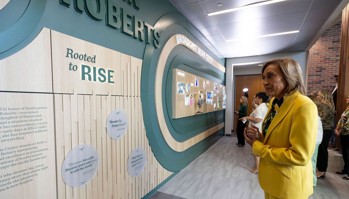 Robin Roberts looking at a timeline wall.