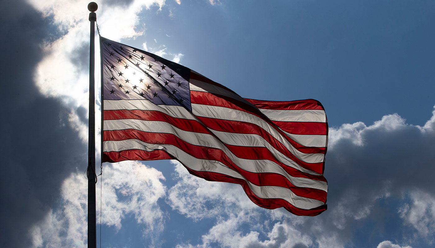 american flag in the sun