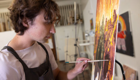 student painting an oil paint artwork