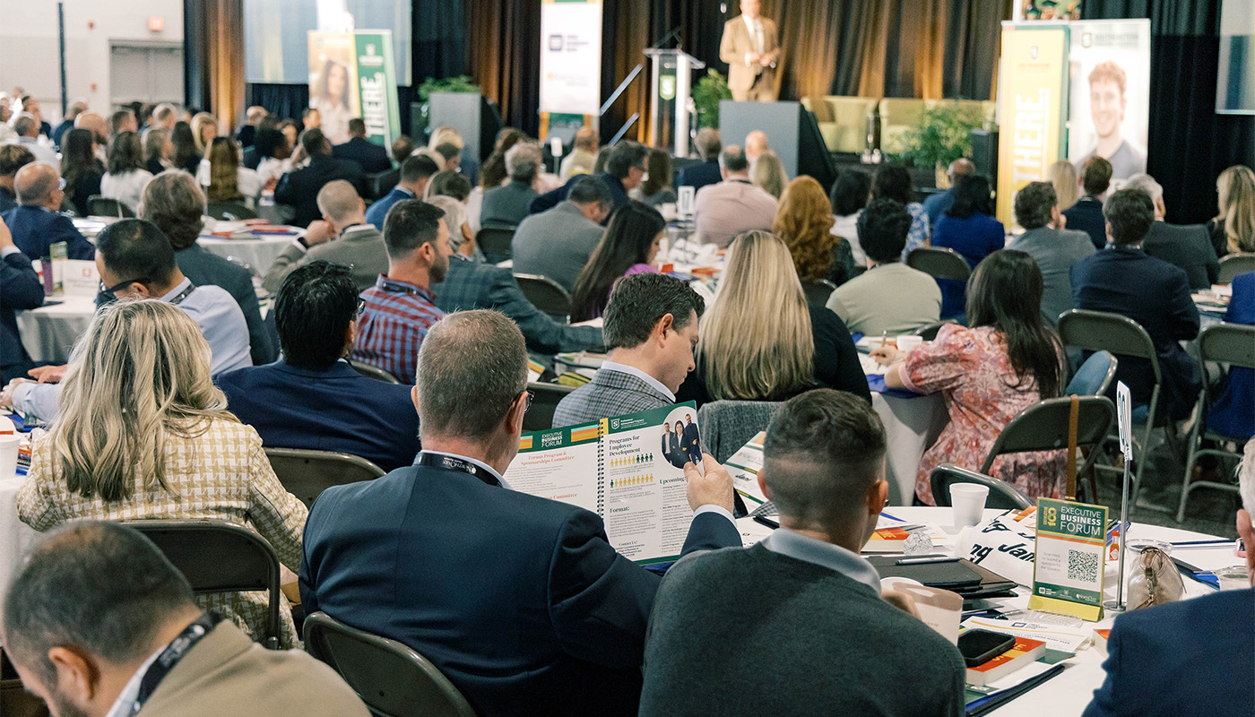 Attendees listen to a speaker at the 2025 Executive Business Forum.