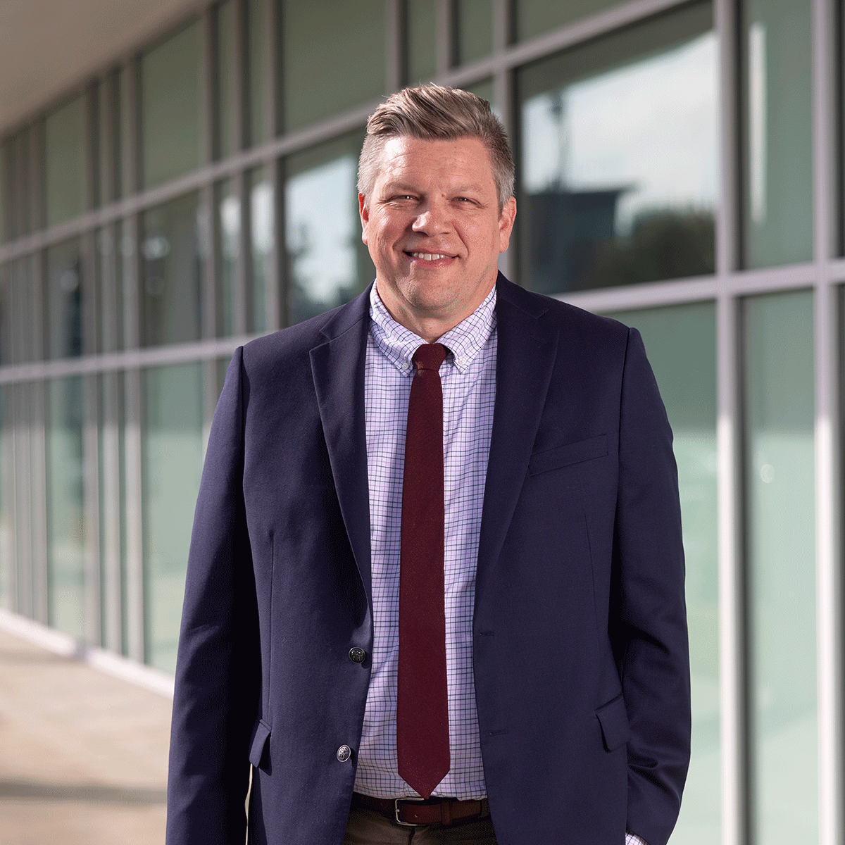 Faculty member Matt Alford stands in front of Garrett Hall