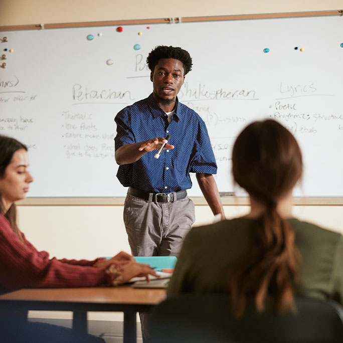 Teacher teaching students.