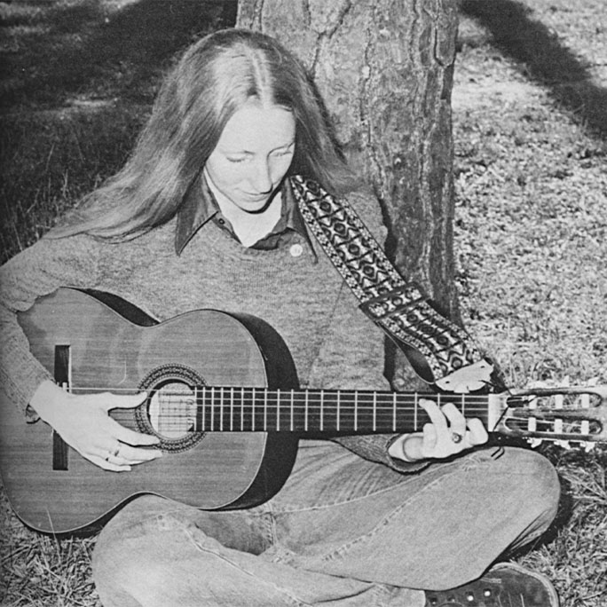 Student playing guitar.