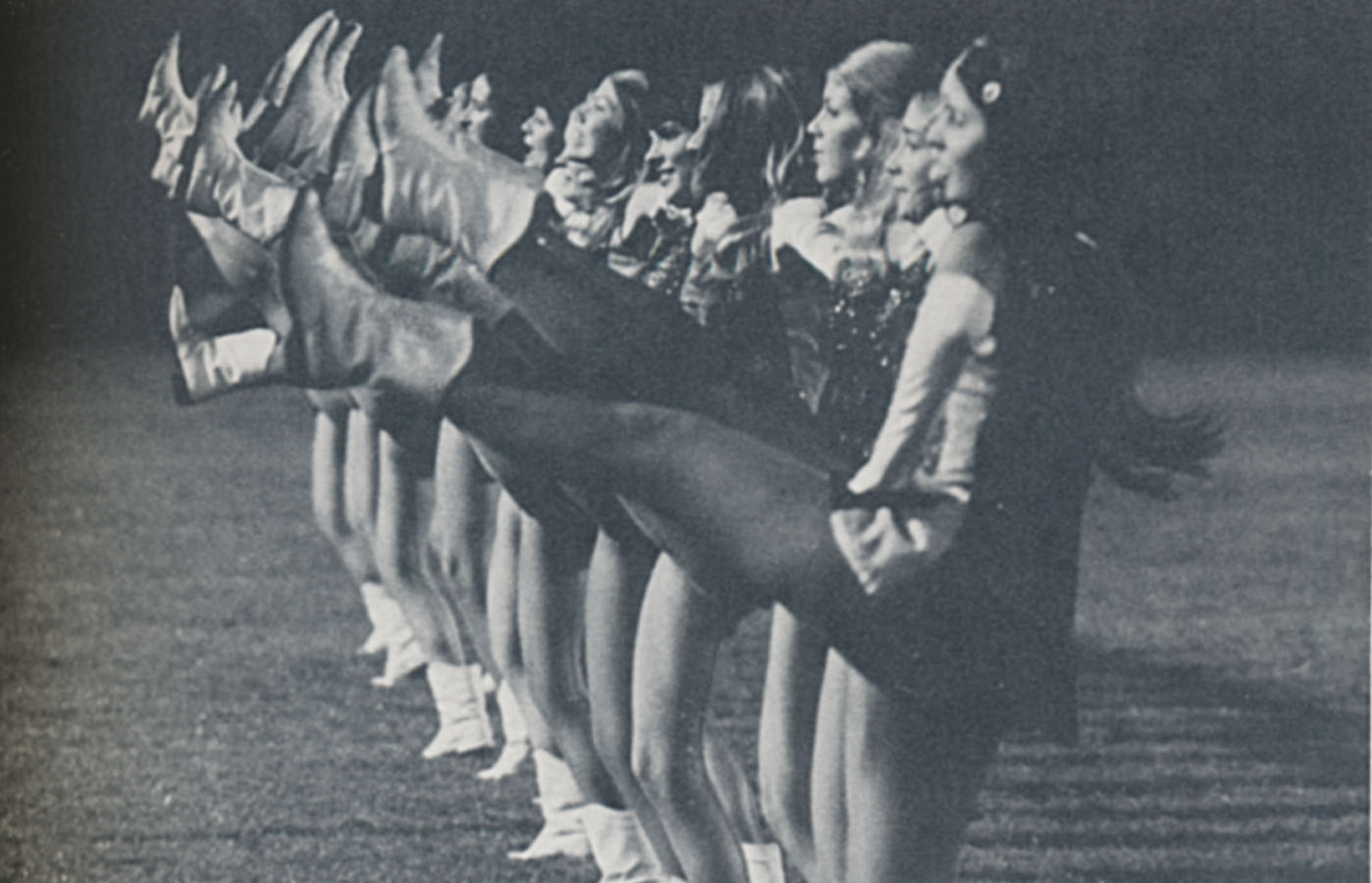 Lionettes dance team doing high kicks.