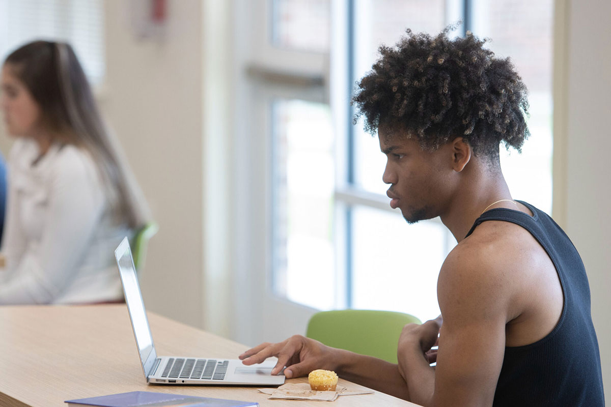 Student studying a computer.