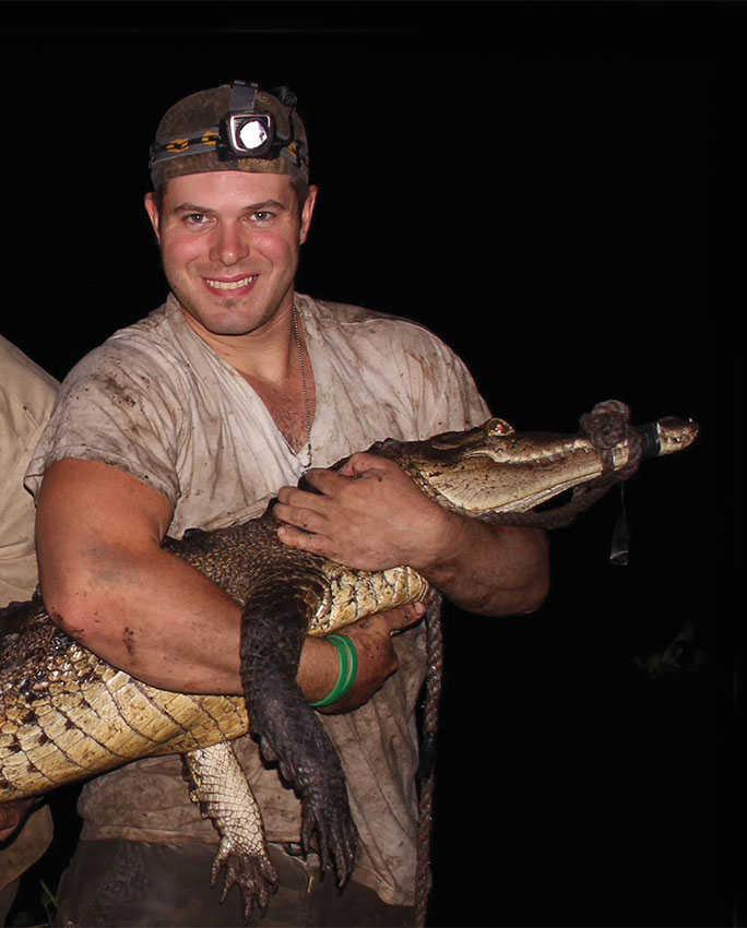 Christopher Murray holding a new crocodile species.