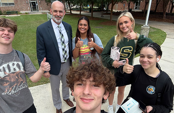 Dr. Skipper on campus with students