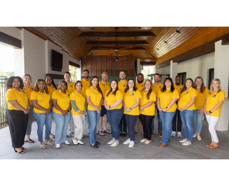 2024-2025 gold council group photo with everyone wearing gold polos with gold council logo on it