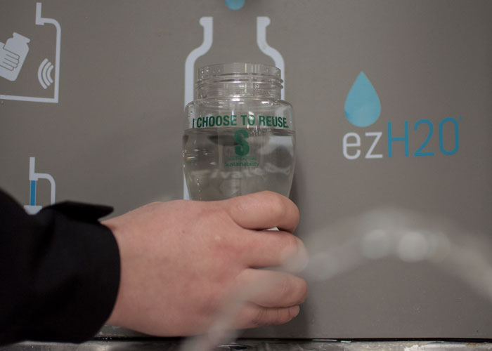 water bottle being filled at fountain station
