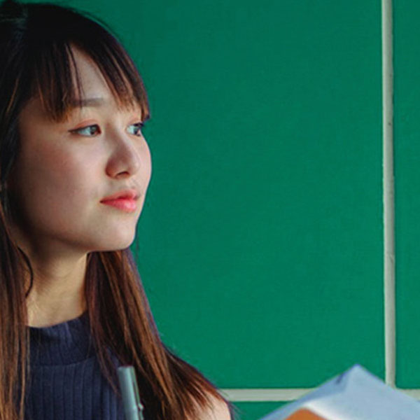 Student looking off into distance.